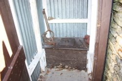 At the Welsh Slate Museum.  The Toilet,  not much comfort to sit and read the paper!!! Wallpaper