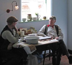 Men deliberating at Blists Hill, Shropshire Wallpaper