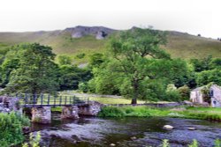 In Monsal Dale Valley with bridge.