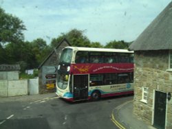 Two double deckers meeting on corner!