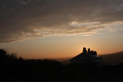 Dramatic sky over the coastguard houses Wallpaper