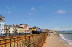 Dawlish promenade with first Intercity 125 heading out of Dawlish - June 2009 Wallpaper