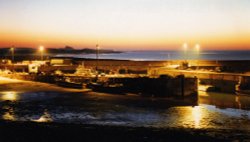 Seahouses Harbour at night looking North to Bamburgh Castle