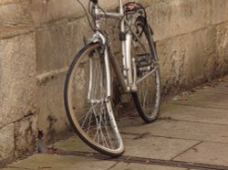 Bent bike, against the wall of Jesus College, Oxford Wallpaper