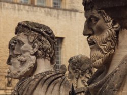 Stone heads outside the Sheldonian Theatre, Oxford Wallpaper