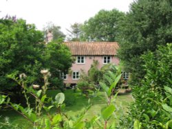 Pretty pink house in the lane. Wallpaper