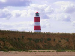 Lighthouse from the beach. Wallpaper