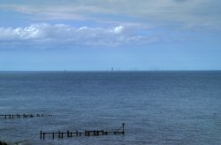 View of the wind turbines from the cliff top.