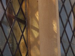 Weak sunlight through stained glass, All Saints' Church, Hillesden, Bucks