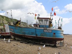 Fishing boat on the beach at Hastings Wallpaper