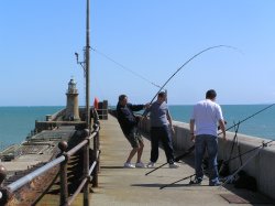 Fishing off the harbour wall at Folkestone Wallpaper