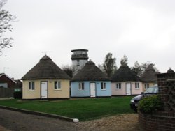 Holiday chalets and a lookout tower Wallpaper