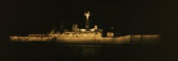 HMS Diomede at night 1985