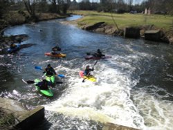 Canoeing opposite the Mill Wallpaper