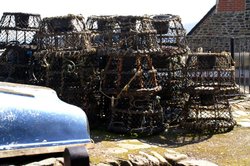 Lobster pots drying in the sun. Wallpaper