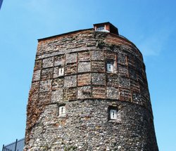 A close-up of the top of the S.E. Tower, it looks like tweed Wallpaper