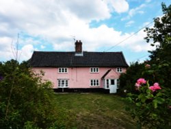 Pink thatched house on outskirts of the village Wallpaper