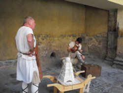 Roman craftsmen labouring at Bath Wallpaper