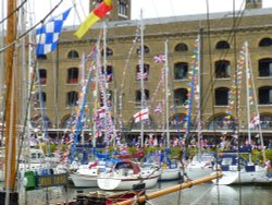Boats and bunting in St Katherine's dock near Tower Bridge Wallpaper