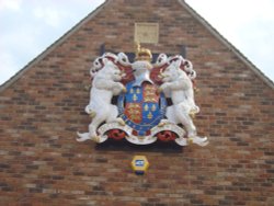 The Arms on the Tithe Barn building Wallpaper