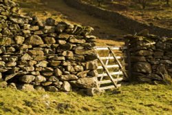 Stone wall and gate Wallpaper