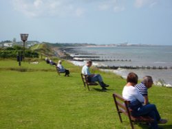 Getting a sea breeze on the cliffs of Hopton on Sea Wallpaper