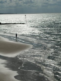 Solo figure on beach