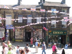 Buskers outside the apothecary in Haworth Wallpaper
