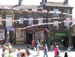 Buskers outside the apothecary in Haworth