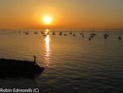 Boats in the setting sun at Yarmouth, Isle of Wight Wallpaper