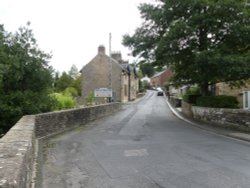 This Picture depicts a sign in Gilsland Village with Northumberland the other half of the village is in Cumbria Wallpaper