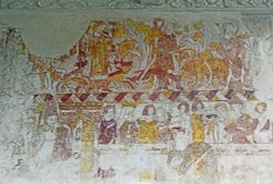 St Hubert's Church Idsworth Hampshire contains some magnificent 14th century wall paintings.