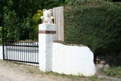 Teddy on the post in Ashbury Wallpaper