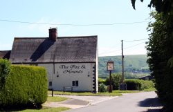 Views of the downs from the village of Uffington. The well-known white horse can just be made out on the hillside. Wallpaper