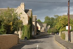 Storm clouds and evening sunshine at Glympton Wallpaper