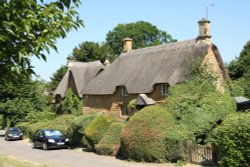 One of the many lovely thatched cottages in Great Tew Wallpaper
