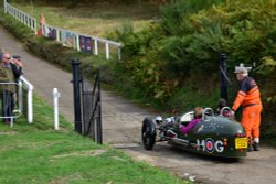 Modern 3-wheeler Ready to Blast off Up the Brooklands Hill Wallpaper