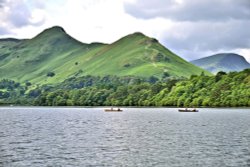 Cat Bells View with Rowers on Derwentwater in the Lake District Wallpaper