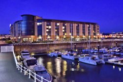 Night View of the Elizabeth Marina and the Radisson Blue Hotel Wallpaper