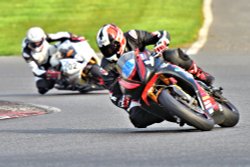 Rounding Clearways at Brands Hatch in a Supersports Race Wallpaper