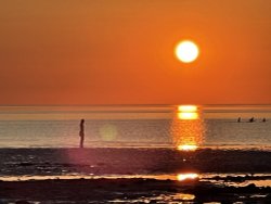 Sunset, woman watching Hunstanton