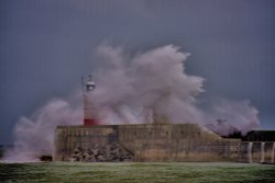 Waves Crashing Over the Lighthouse at Newhaven in Sussex Wallpaper