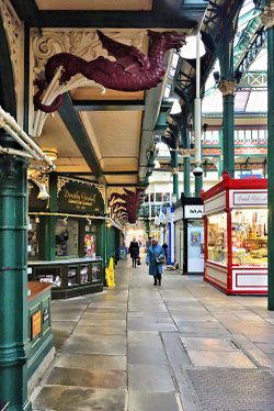 Inside Kirkgate Market, showing the Red Painted Wyvern Gallery Support Brackets