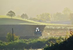 Ploughing on an  Autumn Morning. Wallpaper