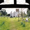 View through the lych gate at All Saints Church, Catherington, Hampshire