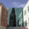 Leicester Cathedral reflected in a more modern building across the street
