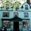 Hairdressers at Bridport Dorset, a charming turquoise building in the square