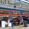 Discussing business, outside the Open Market, Huddersfield.