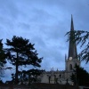 St James' Parish Church at night with Cedar and Pine