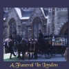 A funeral carriage winds it's way to Highgate Cemetery in London